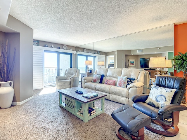 living room with light carpet and a textured ceiling