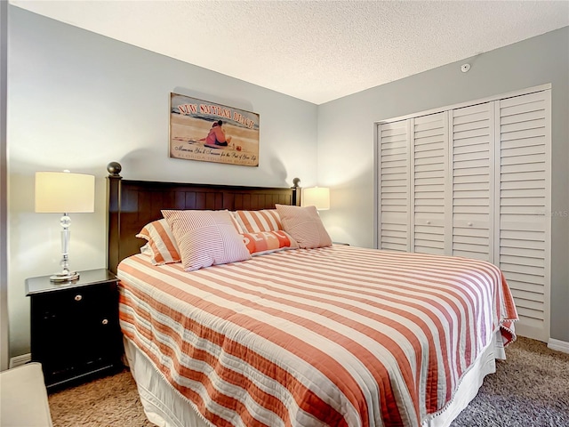 bedroom featuring light carpet and a textured ceiling