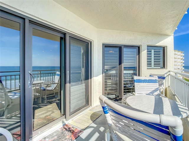 balcony featuring a water view