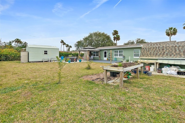 view of yard featuring a gazebo and a patio