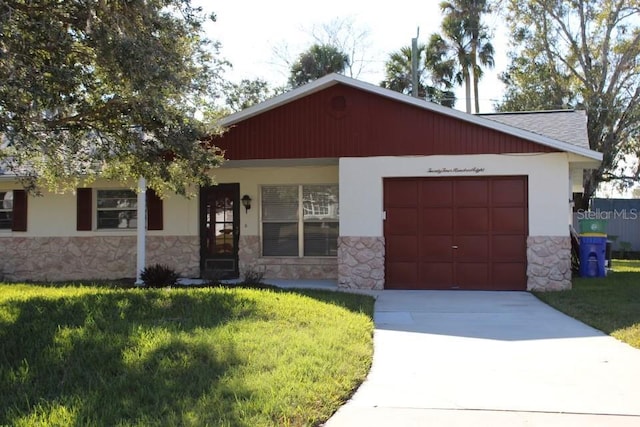 view of front of property with a front lawn and a garage