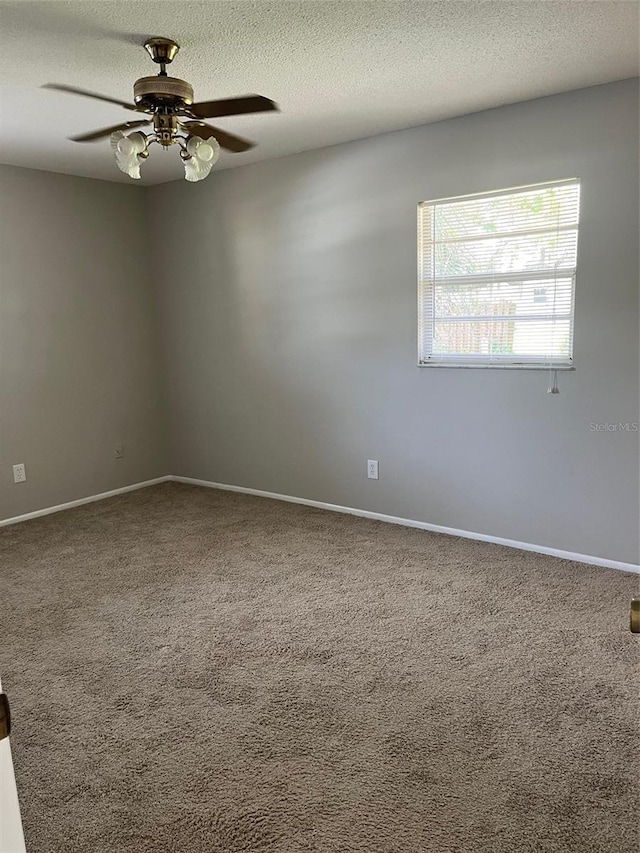 2408 Victory Palm Dr, Edgewater, FL 32141 - carpeted spare room with ceiling fan, a textured ceiling, and baseboards