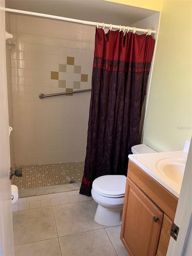 2408 Victory Palm Dr, Edgewater, FL 32141 - full bath featuring tiled shower, toilet, tile patterned floors, and vanity