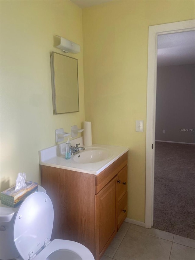 2408 Victory Palm Dr, Edgewater, FL 32141 - half bathroom featuring tile patterned flooring, vanity, toilet, and baseboards