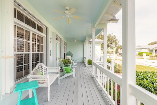 wooden terrace featuring ceiling fan and a porch