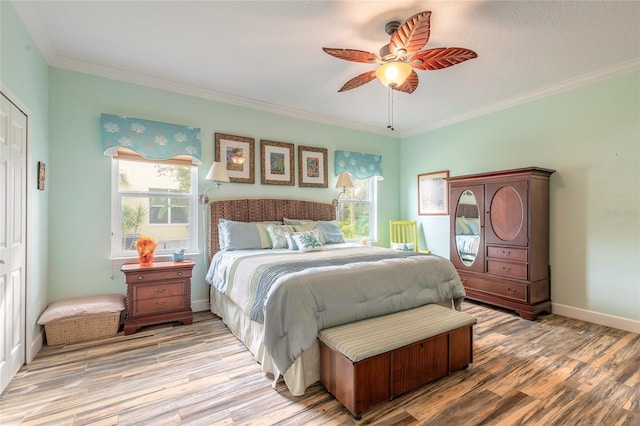 bedroom with ceiling fan, crown molding, and light hardwood / wood-style flooring