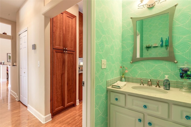 bathroom with wood-type flooring and vanity