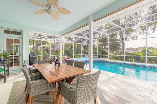 view of swimming pool with a patio area, a lanai, ceiling fan, and grilling area