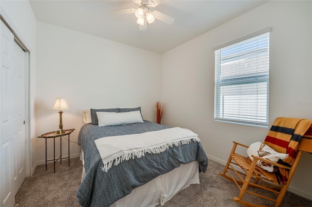 bedroom with ceiling fan, a closet, and carpet floors