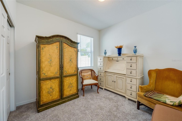 living area with light carpet