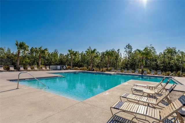 view of pool featuring a patio