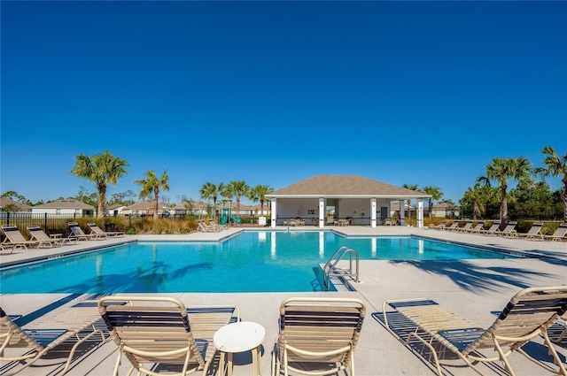 view of swimming pool with a patio