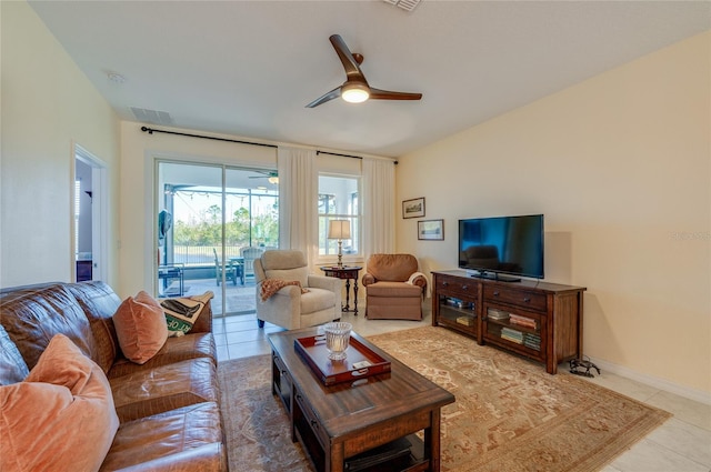 tiled living room featuring ceiling fan