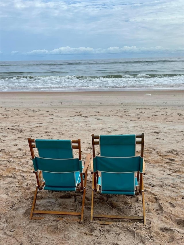 property view of water featuring a beach view