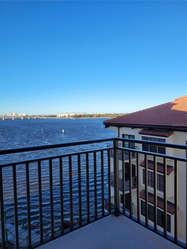 balcony featuring a water view