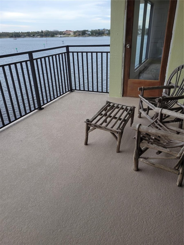 balcony featuring a water view