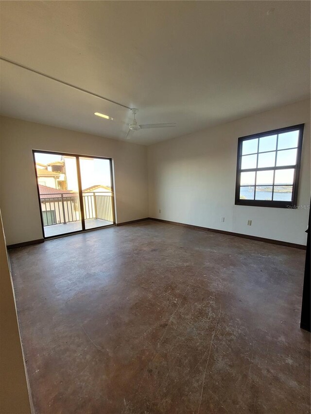 unfurnished room featuring ceiling fan