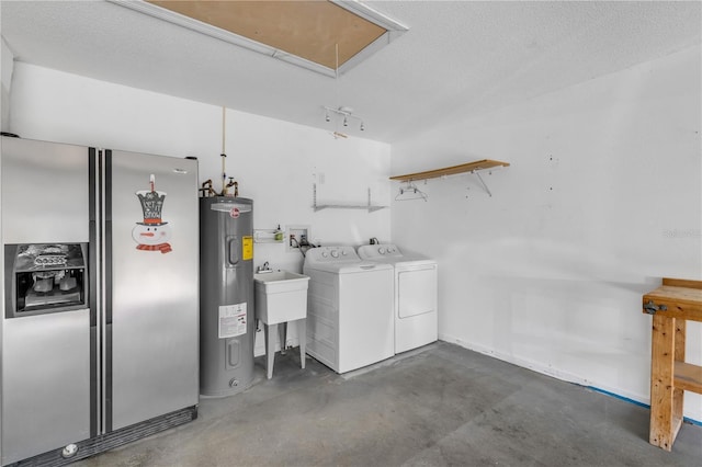 laundry area with independent washer and dryer, sink, electric water heater, and a textured ceiling