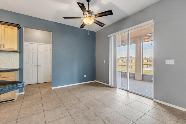 2707 Atlantis Dr, New Smyrna Beach, FL 32168 - unfurnished room featuring light tile patterned flooring and ceiling fan