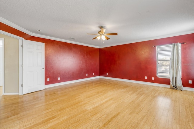 2707 Atlantis Dr, New Smyrna Beach, FL 32168 - spare room with crown molding, ceiling fan, and light hardwood / wood-style floors