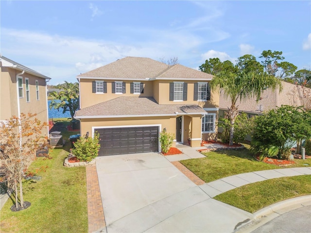 view of front of home with a garage and a front yard