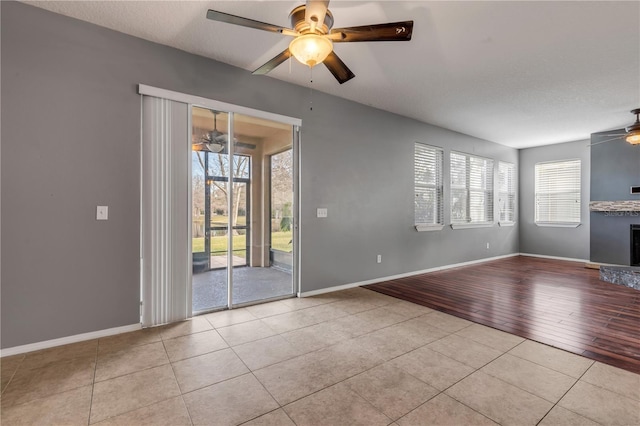 2707 Atlantis Dr, New Smyrna Beach, FL 32168 - interior space featuring ceiling fan, a textured ceiling, and light tile patterned floors