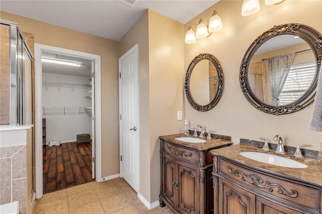 2707 Atlantis Dr, New Smyrna Beach, FL 32168 - bathroom with tile patterned flooring and vanity