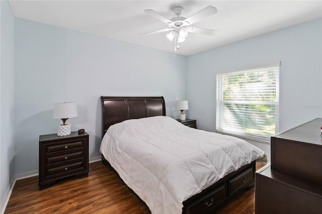 bedroom with dark wood-type flooring and ceiling fan