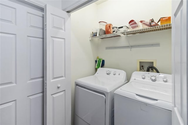 laundry area with washing machine and dryer