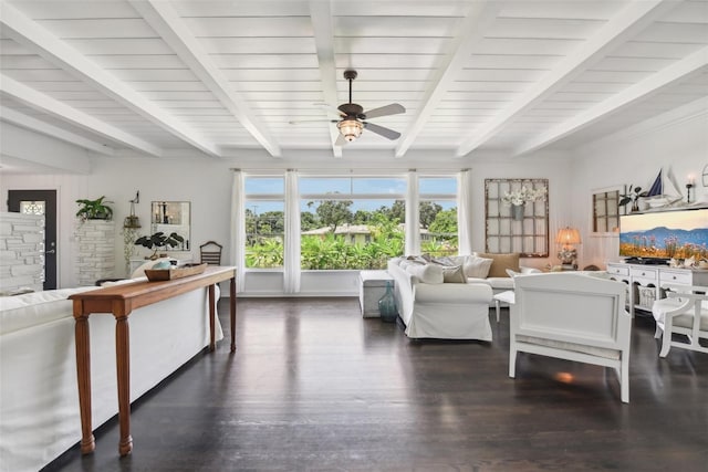 living room featuring ceiling fan, dark wood-type flooring, and beamed ceiling