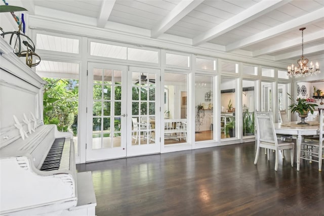 sunroom / solarium with french doors, a notable chandelier, and beamed ceiling