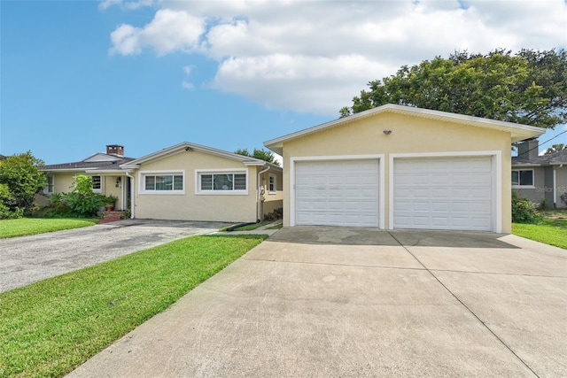 ranch-style house featuring a garage and a front yard