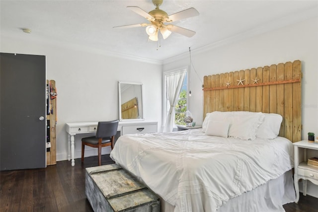 bedroom with ceiling fan, dark hardwood / wood-style floors, and crown molding