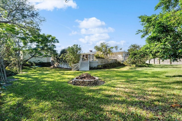 view of yard with a fire pit