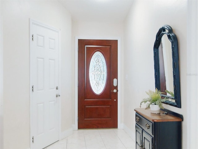 foyer featuring light tile patterned flooring