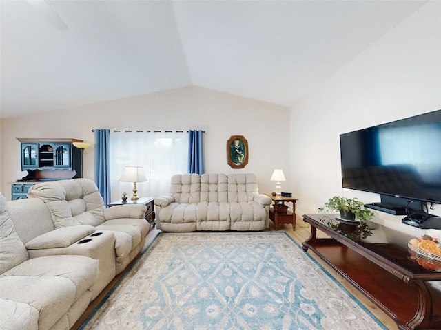 living room with lofted ceiling and hardwood / wood-style floors