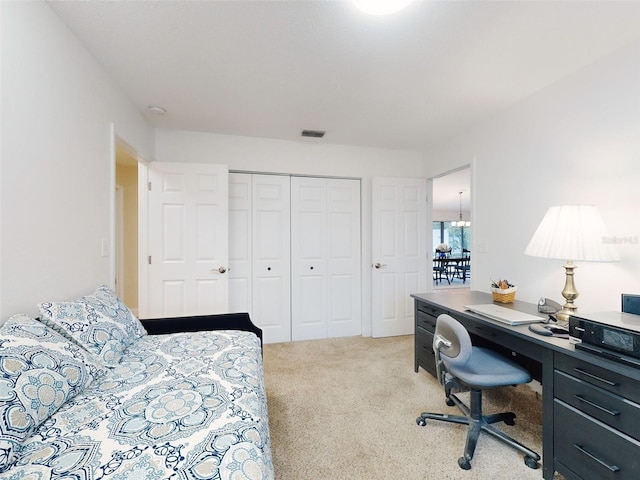 carpeted bedroom with a closet