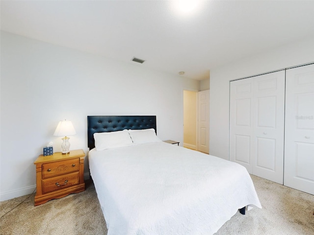 carpeted bedroom with a closet