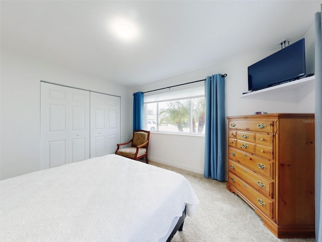 carpeted bedroom featuring a closet