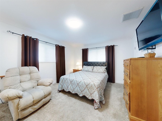 bedroom featuring light carpet