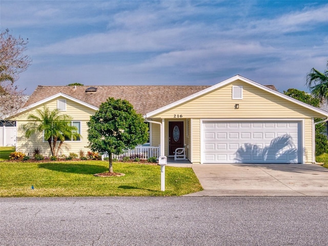 ranch-style home featuring a garage, a porch, and a front lawn