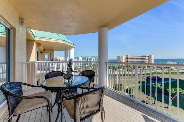 balcony featuring a water view