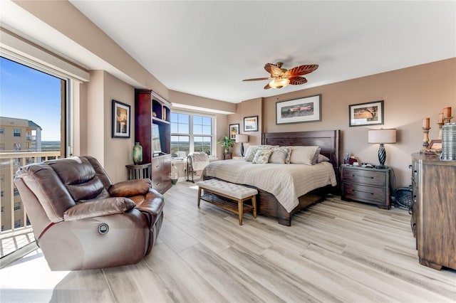 bedroom featuring ceiling fan and light hardwood / wood-style floors