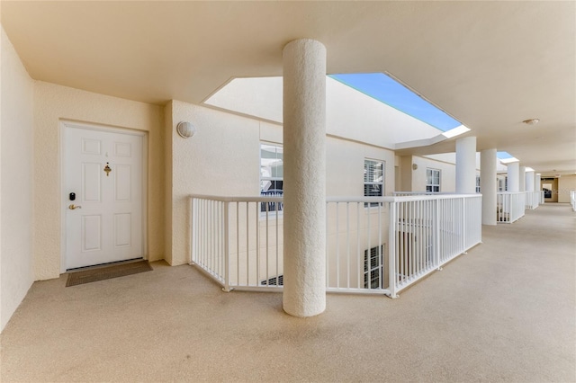 entrance to property with a balcony