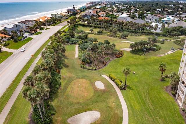 drone / aerial view with a water view and a view of the beach