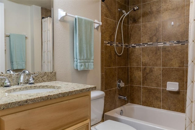 full bathroom with vanity, shower / bath combination with curtain, and toilet