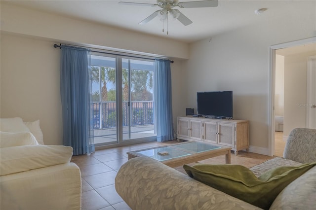 tiled living room with ceiling fan