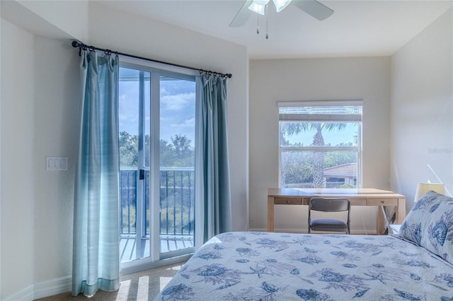 carpeted bedroom with ceiling fan, access to exterior, and multiple windows