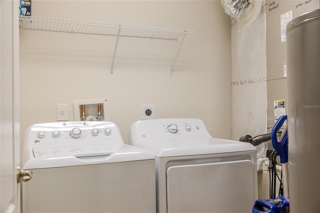 laundry area featuring independent washer and dryer and water heater