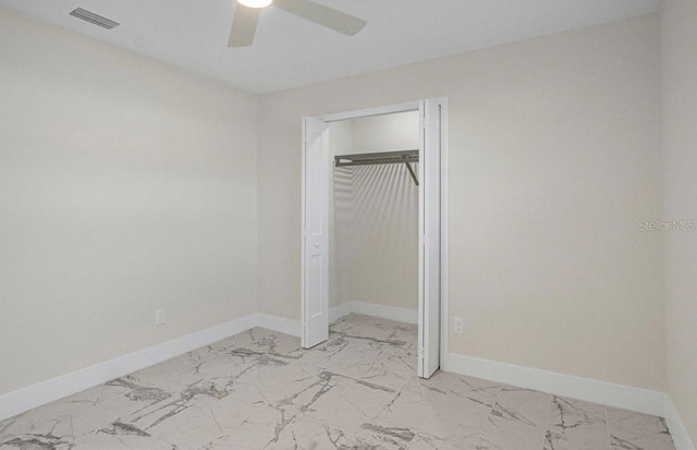 unfurnished bedroom with a closet and ceiling fan